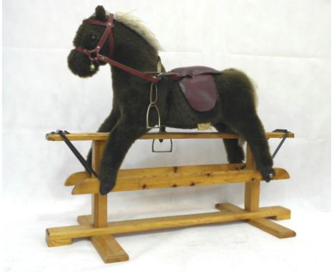 A vintage Pegasus child's saddled rocking horse