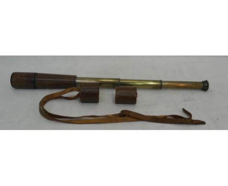 A leather-cased four-drawer telescope