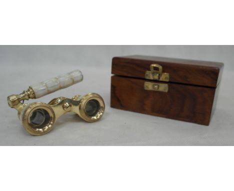 A boxed pair of mother-of-pearl opera glasses