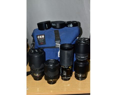 A NIKON AF-S ED DX VR 18-140mm f3.5 lens, a Nikon AF-S G ED 70-300mm f4.5 lens, a Tamron Sp 70-210mm f3.5 lens, a SP Di 90mm 