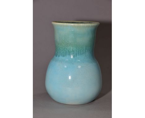 RUSKIN POTTERY, a turquoise globe and shaft vase, blue crystalline glaze to the interior, impressed Ruskin England to the bas