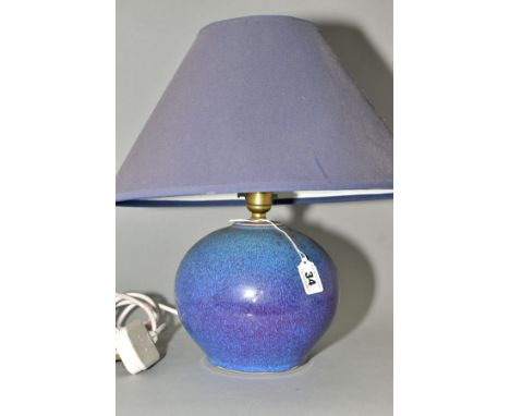 A DARTINGTON POTTERY TABLE LAMP, of globular form, with a high fired mottled blue glaze, impressed seal mark to base edge, he