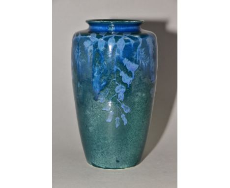 RUSKIN POTTERY, 261 shape vase of high shoulder form, having a dark green mottled glaze with blue underglaze foliate decorati