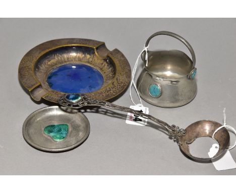 FOUR PIECES OF ARTS AND CRAFTS METALWARE WITH RUSKIN STYLE CERAMIC PLAQUES, comprising a white metal spoon lacking portion of