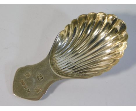A 1983 Birmingham silver scalloped shaped caddy spoon by A. Marston &amp; Co. 18.1g