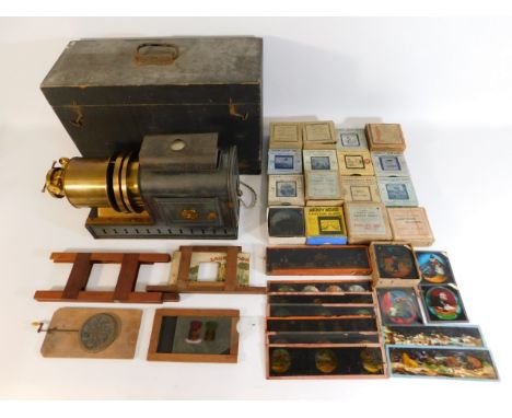 A cased Perken &amp; Son Ltd. magic lantern projector with accessories with many slides including Mickey Mouse, Jack &amp; th