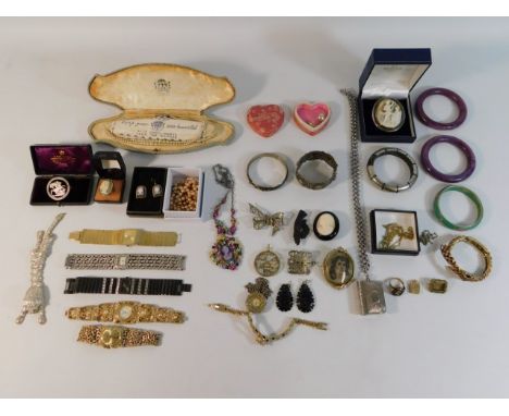 A quantity of costume jewellery including a coin brooch, silver earrings, cameo earrings &amp; wrist watches