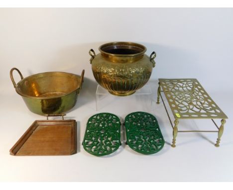 A brass wash basin with handles, a decorative brass urn, a brass skillet, two modern skillets &amp; an early 20thC. oak crumb