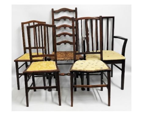 A pair of Edwardian bedroom chairs twinned with three other chairs including an oak ladder back