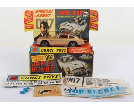 Corgi Toys 261 James Bond Aston Martin D.B.5 from the Film “Goldfinger” vintage 1960's issue, gold body, with working ejector