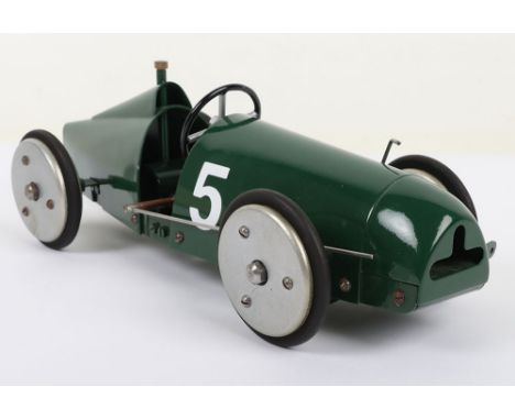 ‘Round the Pole’ tethered Racing car, shaped green painted metal body, R.N.5, with aluminium wheels with black rubber tyres, 