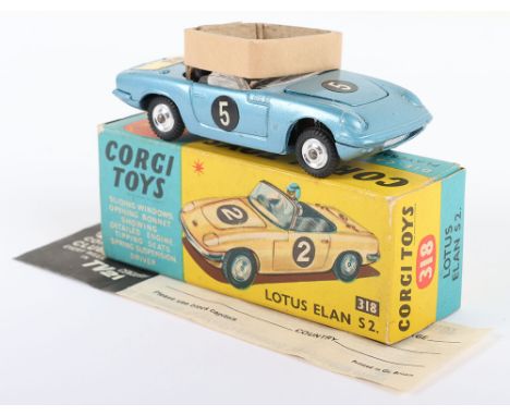 Corgi Toys 318 Lotus Elan S2. metallic blue body, with driver, spun wheel hubs, Ive got a tiger in my tank decal on boot, wit