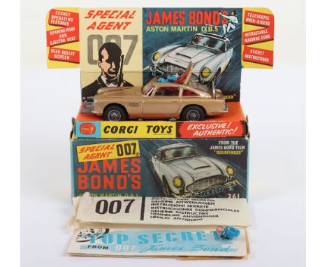 Corgi Toys 261 James Bond Aston Martin D.B.5 from the Film Goldfinger vintage 1960's issue, gold body, with working ejector s