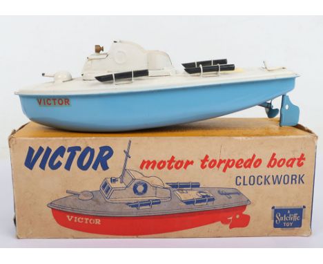 Sutcliffe boxed tinplate clockwork Torpedo boat Victor, light blue hull and cream decks, 24cm (9 ½”) long, good working condi