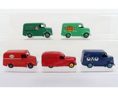 Four Dinky Toys Trojan Vans, 31a Trojan Esso, red body, maroon hubs, some paint touch ups. 31c Trojan Chivers Jellies, green 