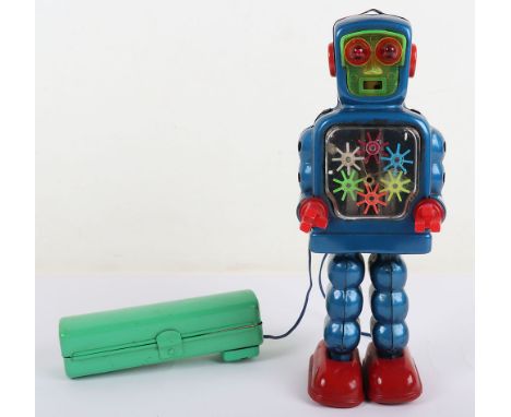 A Yoshiya Japanese KO Battery Operated Remote-control High-Wheel Robot, circa 1960’s,  blue tinplate robot, with red plastic 