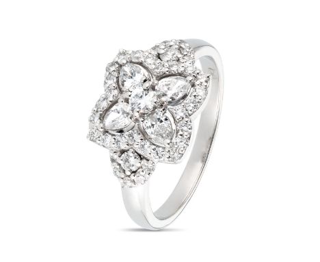 Crafted from 18K white gold, this ring boasts a beautiful cluster of diamonds totaling 0.85ct FG Vs/Si, which will catch the 