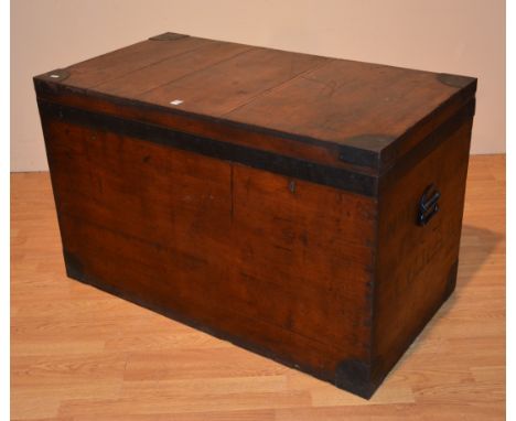 A hardwood fitted trunk, with metal banding and metal lined interior, fitted with three pull out fabric drawers with leather 