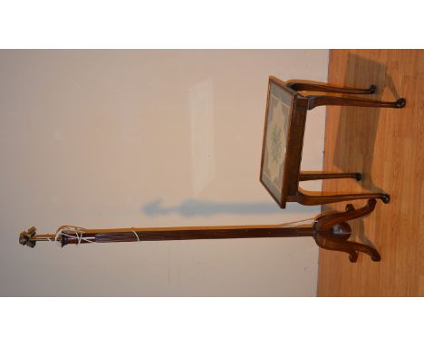 A mahogany floor lamp, with reeded column raised on downswept supports, 161cm high, together with a mahogany occasional table