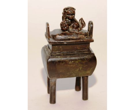 A Chinese bronze censer from the Ming Dynasty, the detachable lid with dog of foe finial, 16.5cm high