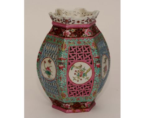 A Chinese Qing famille rose porcelain lantern, decorated with reticulated pierced circular panels, 24cm high