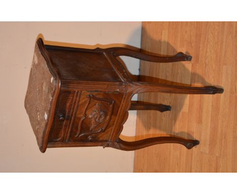 A French marble topped bedside cabinet, the brown marble top over a single drawer and cupboard door with carved panel, raised