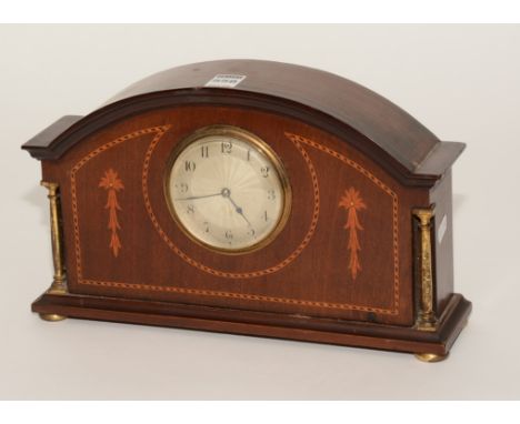 An Edwardian mahogany inlaid mantle clock, the silvered dial with Arabic numerals and herringbone inlay, 19cm high x 31.5cm w