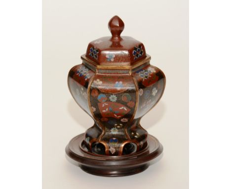 A 19th century Japanese cloisonne enamel vase with cover from the Meiji period circa 1880, with octagonal lobed body, decorat