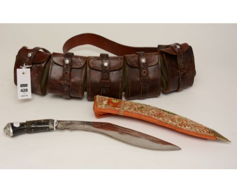 A brown leather and canvas bandolier cartridge belt, circa Boer War, with five ammunition compartments, together with a Gurkh
