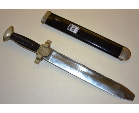 A German World War II Nazi Red Cross subordinate dagger, with plated hilt and black plastic grip, the cross guard centred by 