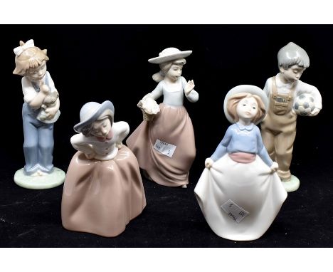 Five Nao figures of young children, four girls one boy with footballCondition: No obvious signs of damage or restoration