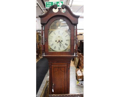 A George III Welsh oak eight day longcase clock by M.Evans of Llanernyw, circa 1810, swan neck cornice with floral carving, a