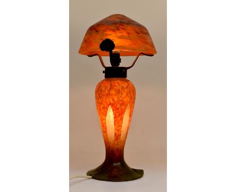 An Art Nouveau table lamp by Schneider, glass shade, overlaid and cut base. Approx 38cm high. Mottled blue, orange & green gl