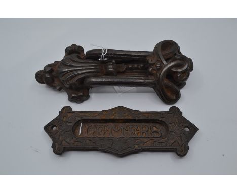 A Victorian Kenrick cast iron door knocker, together with a Victorian cast iron 'Letters' slot, number 2956, in the Gothic st