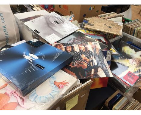 A large box of LP records, ex new shop stock, damage to covers vinyl new and three box sets US colour vinyl deluxe x 2 and Ro