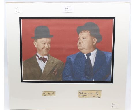 A lovely full colour picture of Stan Laurel and Oliver Hardy - Mounted with both their Autographs from an Autograph book - Lo