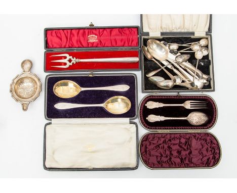 A collection of silver flatware including: A pair of Arts &amp; Crafts serving spoons, Josiah Williams &amp; Co, London, 1925