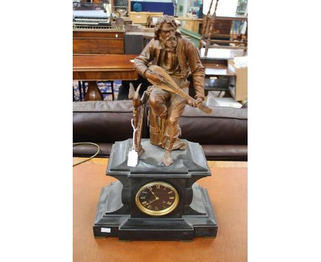 A mid Victorian 'WH Mariott' eight day black slate mantle clock, painted spelter figure of a guitarist to top, the dial stamp