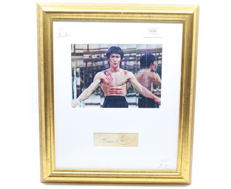 BRUCE LEE - The famous Martial Arts Film Icon. A colour picture of Bruce Lee - mouted and framed with his signature / autogra