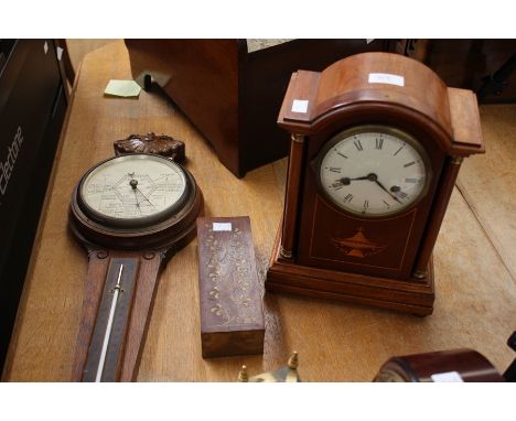 A 1950s inlaid mantel clock, white enamel dial, Roman numerals; together with a 1930s barometer and inlaid domino set (3)