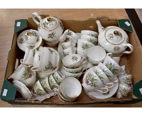 A Regency bone china Lilly of the Valley part tea service, comprising; coffee pot, tea cups, coffee pots, saucers, side plate