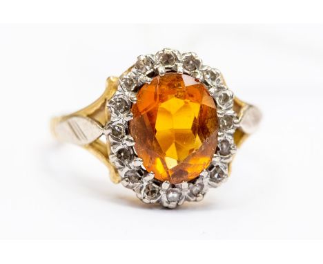 **AUCTIONEER TO ANNOUNCE CHANGE TO DESCRIPTION, THIS ITEM IS CITRINE NOT TOPAZ** A citrine and diamond&nbsp;18ct gold ring, o