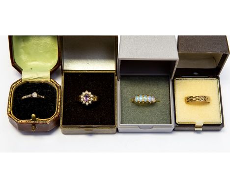 A collection of gold rings to include a diamond set 18ct gold ring, total gross weight approx. 1.8gms, an opal and 9ct gold r