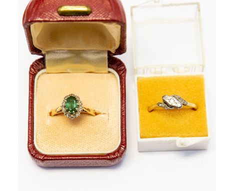 An emerald and diamond 18ct gold cluster ring, the oval emerald measuring approx. 6mm x 4mm, with a diamond set surround, siz