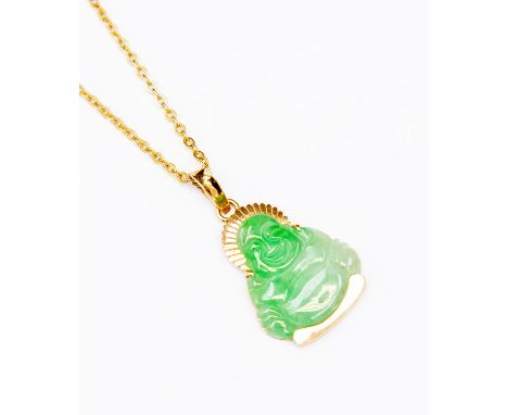 A nephrite jade Buddha pendant with 18ct gold decoration, on an 18ct gold chain, length approx. 18'', total gross weight 8.6g