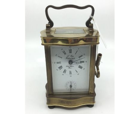 A Brass Carriage Clock by "L'Epee, France".&nbsp; 11.5cm in height, 7cm in width. Complete with key, original receipt from pu