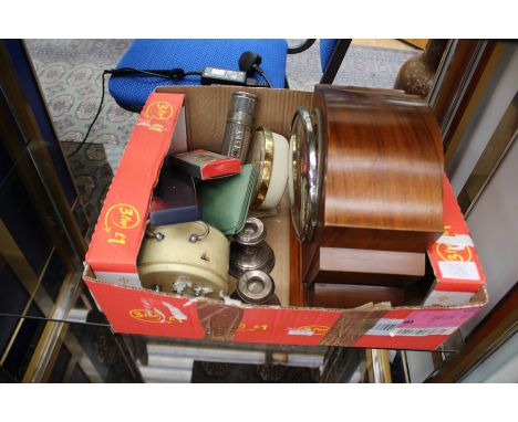 A collection of assorted clocks, including an Art Deco walnut veneered mantle clock, various other small clocks, a travelling