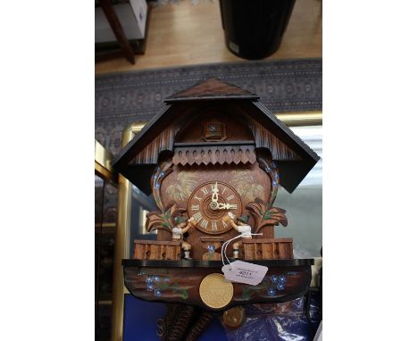 An early 21st Century Cuckoo clock, with weights