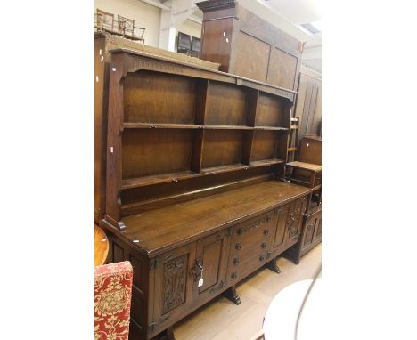 &nbsp;A 20th Century oak dresser on sideboard, moulded cornice above two tier shelves on a rectangular sideboard base fitted 