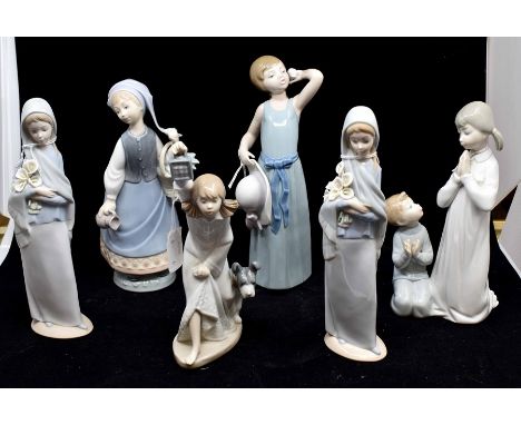 A Lladro collection of lady figures, including girl in matte with flowers, girl with hat and holding a single rose, girl with
